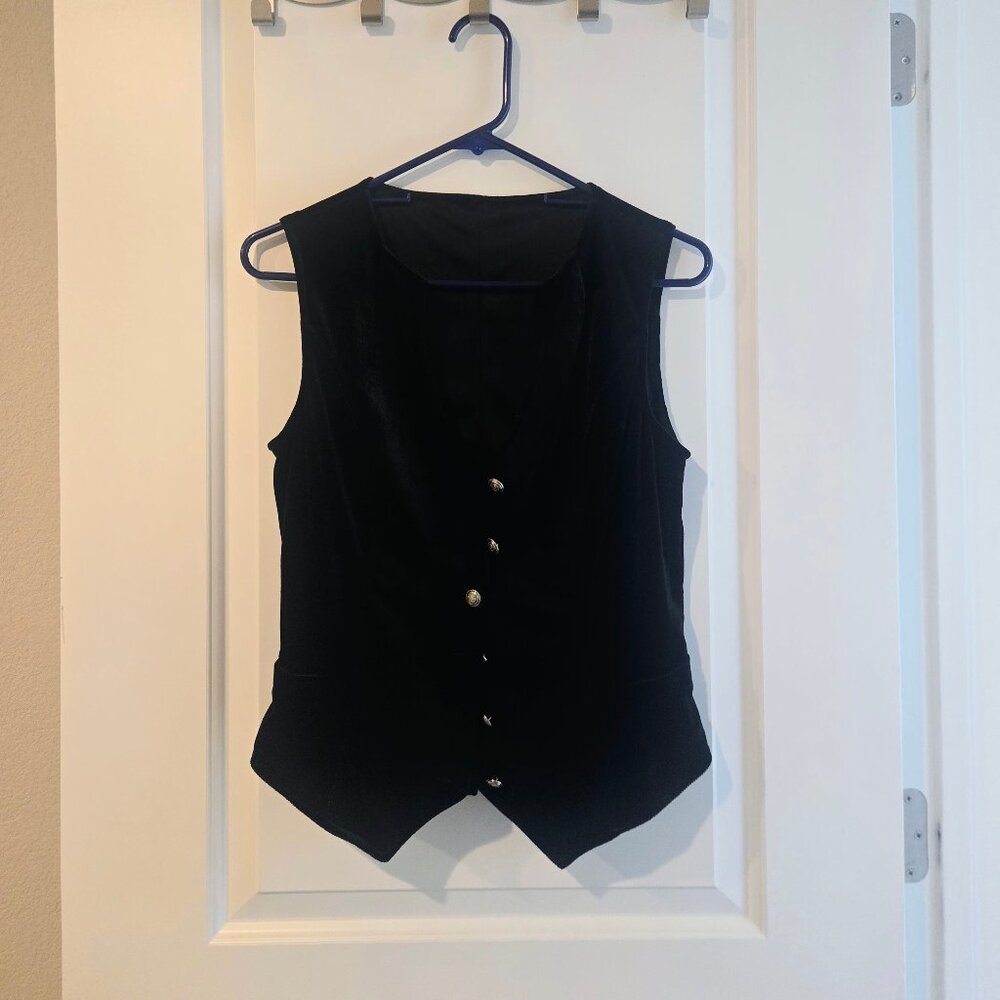 Small black velvety button up vest with detailed buttons